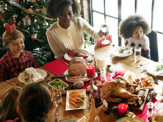 A family eating Christmas dinner.
