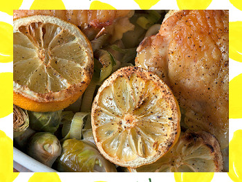 A roasting dish of Lemony Chicken with Brussel Sprouts and Leeks.
